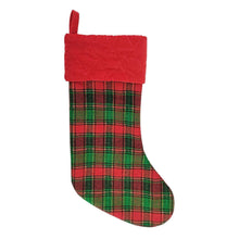 Quilted plaid holiday stocking with red top band and hanging loop