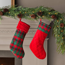 Quilted plaid holiday stocking with red top band and hanging loop