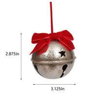 Silver bell ornament with red velvet bow and star cutout details