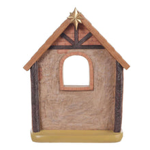 Nativity set wooden stable house figurine with arched doorway and star on the roof.