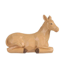 Nativity set donkey figurine with tan finish and carved legs, resting on a base.