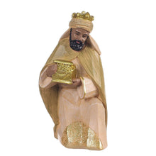 Nativity set carved king figurine holding a gold chest, beige and gold