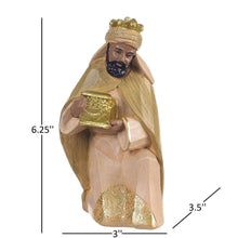 Nativity set kneeling king figurine holding a golden gift container with ornate detailing.
