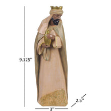 Nativity set king figurine holding a gold oil lamp, wearing a crown and long robe.