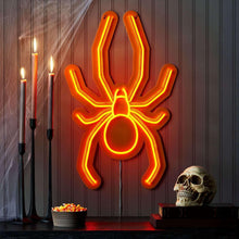 Orange neon spider wall decor with outlined legs and circular abdomen