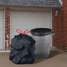 Black heavy-duty trash bags with red tie handles, beside a large gray trash bin