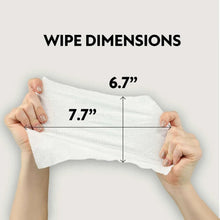 Baby wipe held between hands, white cloth with wavy edge