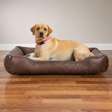 Leather-brown cuddler pet bed with quilted sides and plaid insert