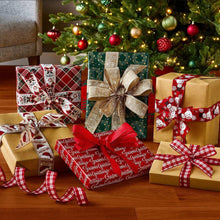 Holiday gift ribbons with bows in red plaid and patterned wraps on wrapped boxes
