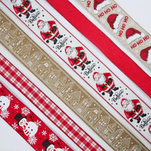 Wired ribbon close-up with red plaid, beige buildings stripe, and Santa “Believe” pattern