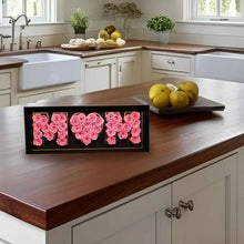 Preserved rose gift display box with pink roses spelling 'MOM' on front