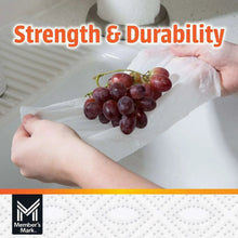 Hands using a 2-ply paper towel sheet to wipe grapes, strong and durable