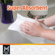 White paper towel sheet wiping a surface, super absorbent 2-ply
