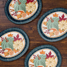 Set of Thanksgiving oval paper plates with teal patterned rim and autumn pumpkin illustration