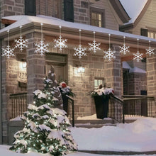 LED snowflake string lights with glowing white snowflake decorations along a line