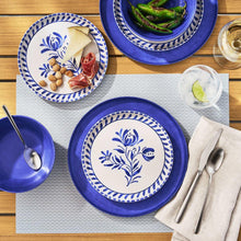 Cobalt dinnerware set with blue patterned plates and serving bowls