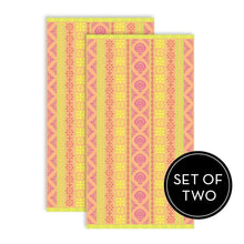 Set of two fashion beach towels in bright yellow, pink, and purple striped floral