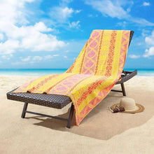 Fashion beach towel with bright yellow, pink, and purple geometric floral pattern