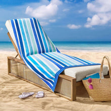 Oversized beach towel with blue, white, and teal vertical stripes