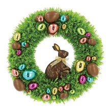 Green tinsel wreath with chocolate-style bunny silhouette and multicolor hanging baubles