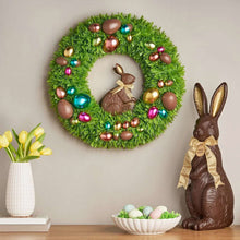 Green tinsel wreath with chocolate-style bunny center and multicolor baubles