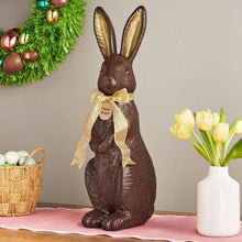 Chocolate bunny décor with gold ribbon and ear details, standing on flat base