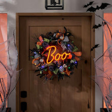 Colorful Halloween wreath with neon 'Boo' lights, striped ribbons and spiderweb accents
