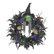 Pre-lit witch wreath with green face, long gray hair, black hat, and purple-green LED lights
