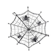 Pre-lit black spiderweb decoration with four spiders and clear LED bulbs