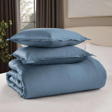 Blue comforter set with two pillows and folded comforter, stacked