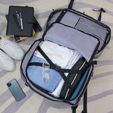 Gray travel backpack open to reveal packing compartments with mesh organizer
