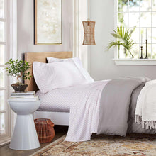 White printed sheet set with small geometric dot pattern on pillowcases and fitted sheet