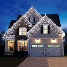 LED icicle light set with cool-white string lights draped across a house roofline