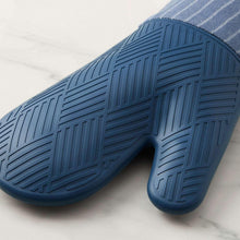 Indigo silicone oven mitt fingertips with textured grip pattern on palm
