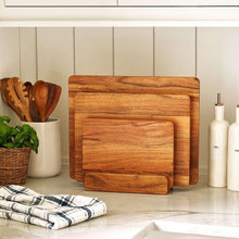 Acacia wood cutting board set with square and rectangular boards stacked