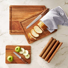 Acacia wood cutting board set with beveled groove edge and sliced bread pieces