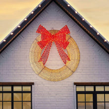 Pre-lit wreath with red bow and gold-lit ribbon garland ring