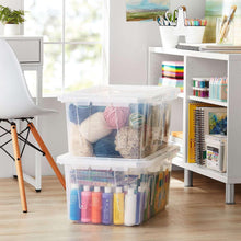 Clear stackable storage tote with lid holding yarn and craft supplies