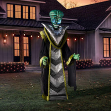 Animated alien yard decoration with teal head, silver chevron robe, green trim, black arms