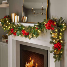 Pre-lit red floral garland with pine greenery, poinsettias, and warm string lights