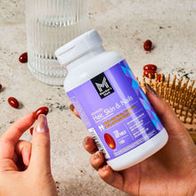 Member's Mark Advanced Hair, Skin & Nails softgels bottle held in hand, front label visible