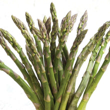 Bundle of green asparagus spears with closed tips on a white background.