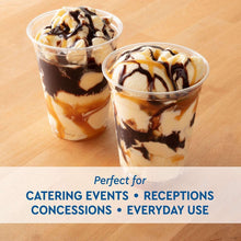 Clear plastic cups with chocolate-drizzled dessert, two-cup view on tabletop