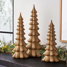 Three resin decorative trees, stacked tiers and rounded base, tan wood finish
