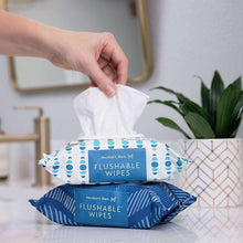 Flushable wipes pouch opened with tissue sheet, fresh scent, blue-and-white pattern