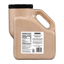 Granulated garlic jug with black lid and nutrition facts label on back