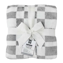 Folded gray-and-white buffalo check lounge throw blanket with bow and tag