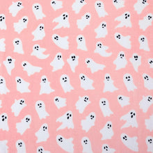 Close-up of pink Halloween ghost pattern on a lounge throw blanket