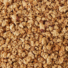 Crunchy honey almond granola clusters, golden-brown rolled oats and nuts