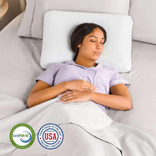 White quilted memory foam pillow under head, lying on bed